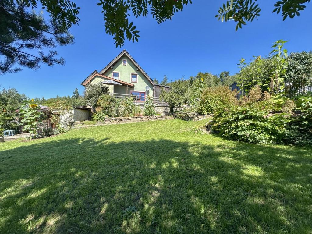 a house with a large yard with green grass at Hochfels in Stadlern