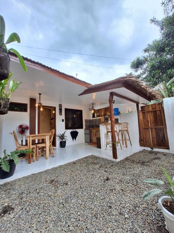 a kitchen and dining area of a house at Tulog 1 in El Nido
