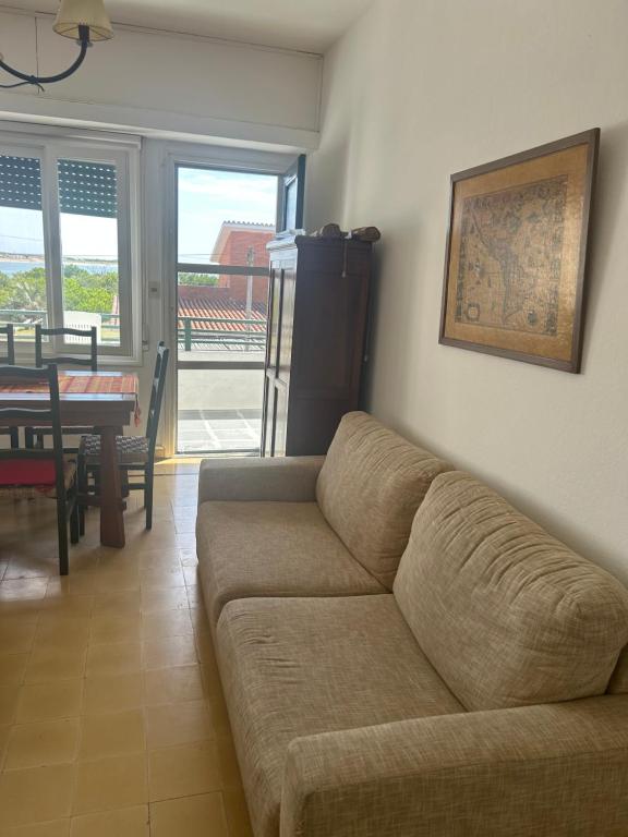 a living room with a couch and a dining table at Irape in La Paloma