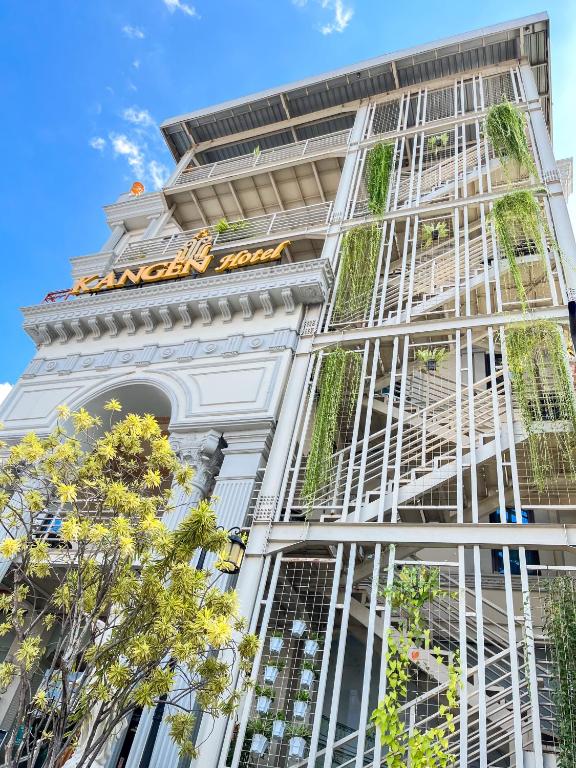 a building with a sign on the side of it at Kangen Boutique Hotel in Yogyakarta