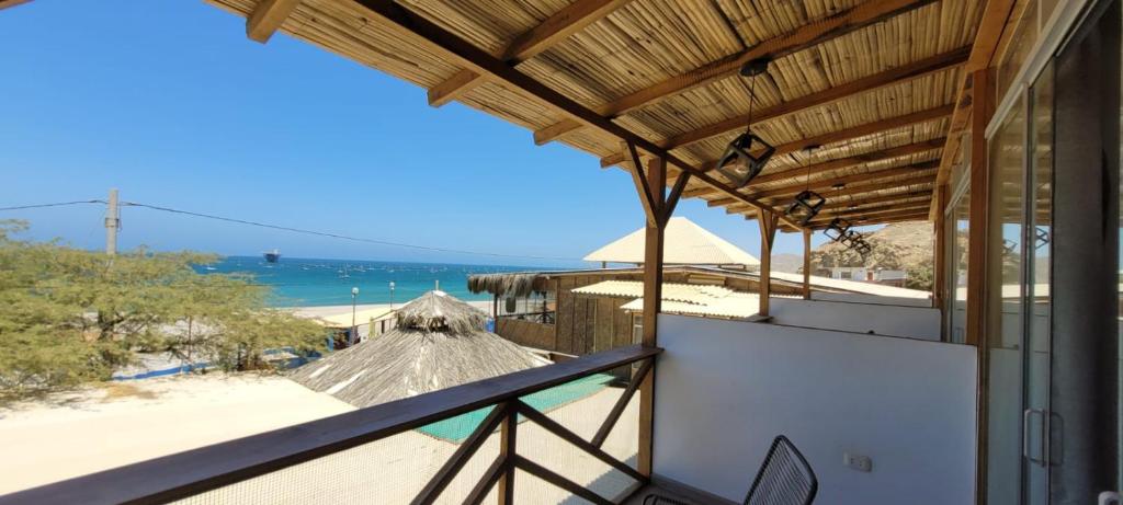 a balcony with a view of the beach at Black Marlin - Restaurant and Lodge in Talara