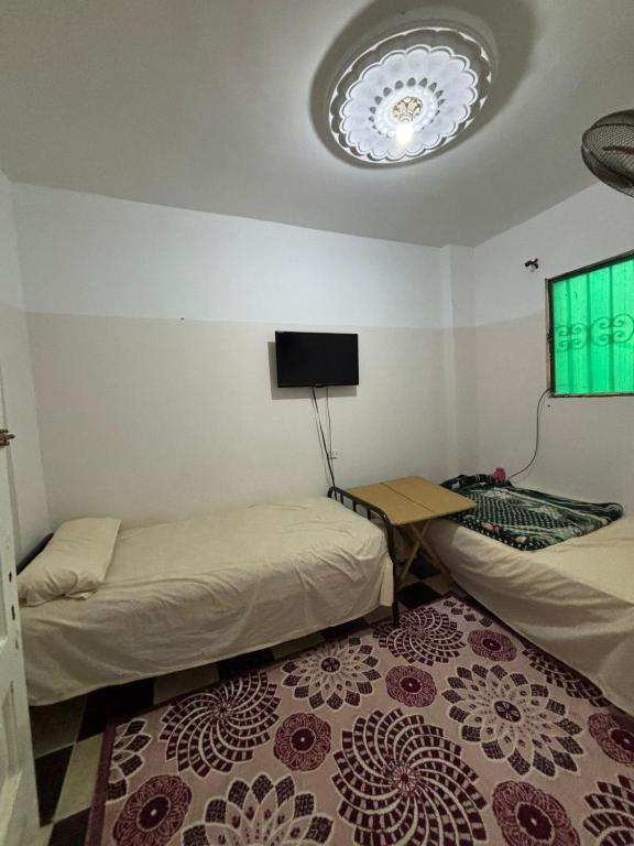 En eller flere senge i et værelse på ELaraby 1