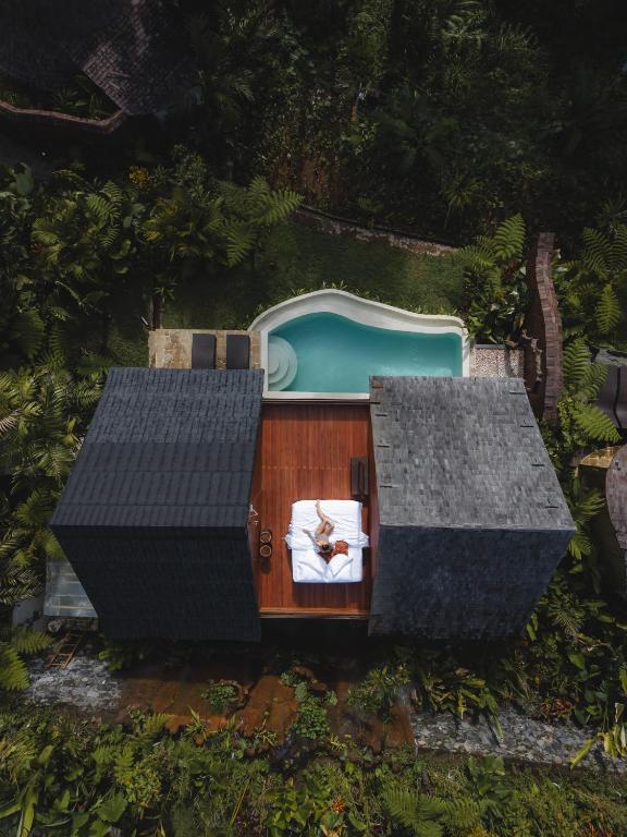 an aerial view of a house with a swimming pool at Umawana Villas in Tegalalang