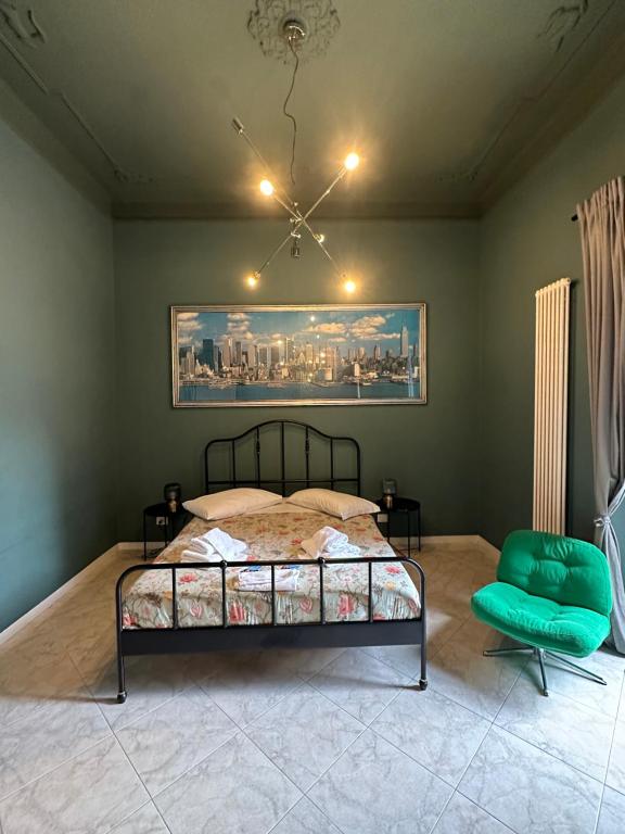 a bedroom with a bed and a painting on the wall at Bari Holiday Garibaldi 74 in Bari