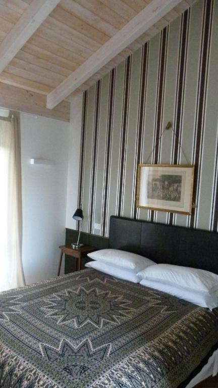 Postel nebo postele na pokoji v ubytování Taverna Centomani