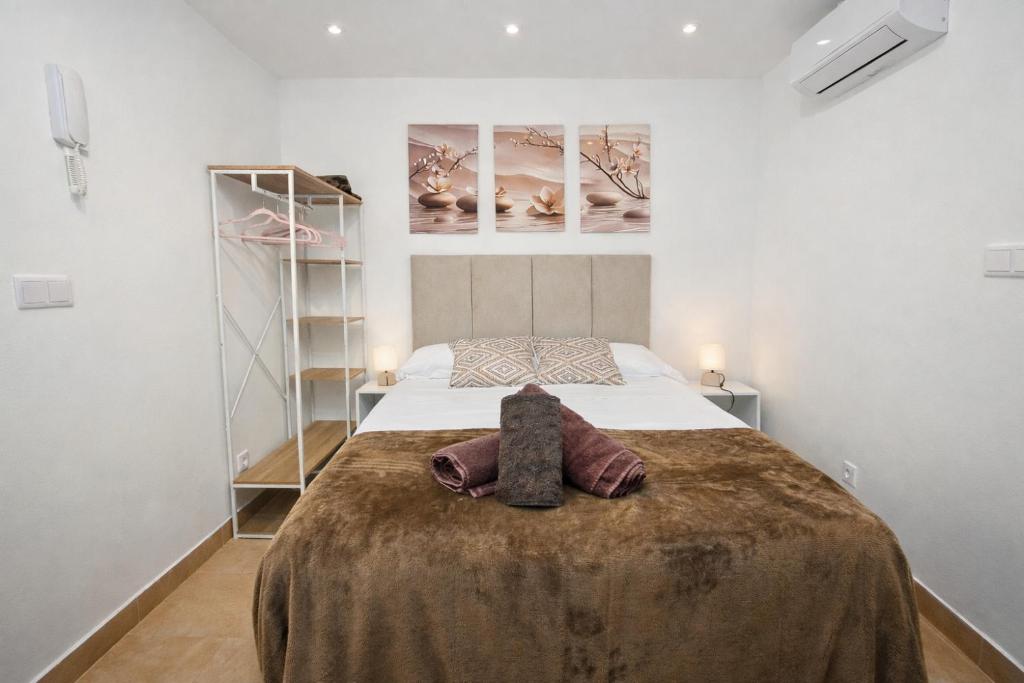 En eller flere senge i et værelse på Apartamento para pareja en Jaén