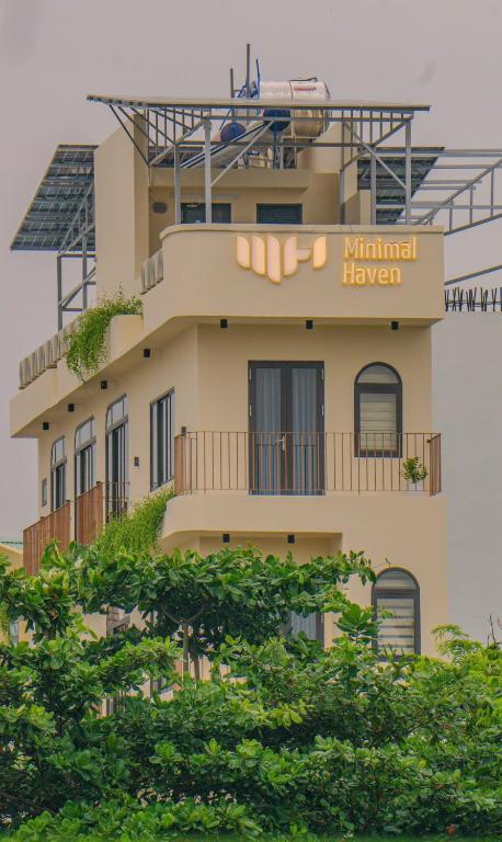 a building with a train on top of it at Minimalhaven Stay in Vung Tau