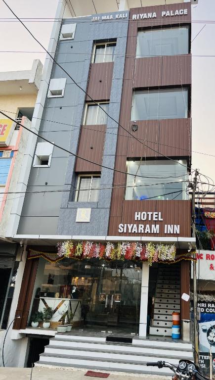 a hotel with a sign that reads hotel swan inn at HOTEL SIYARAM Inn in Jāmb