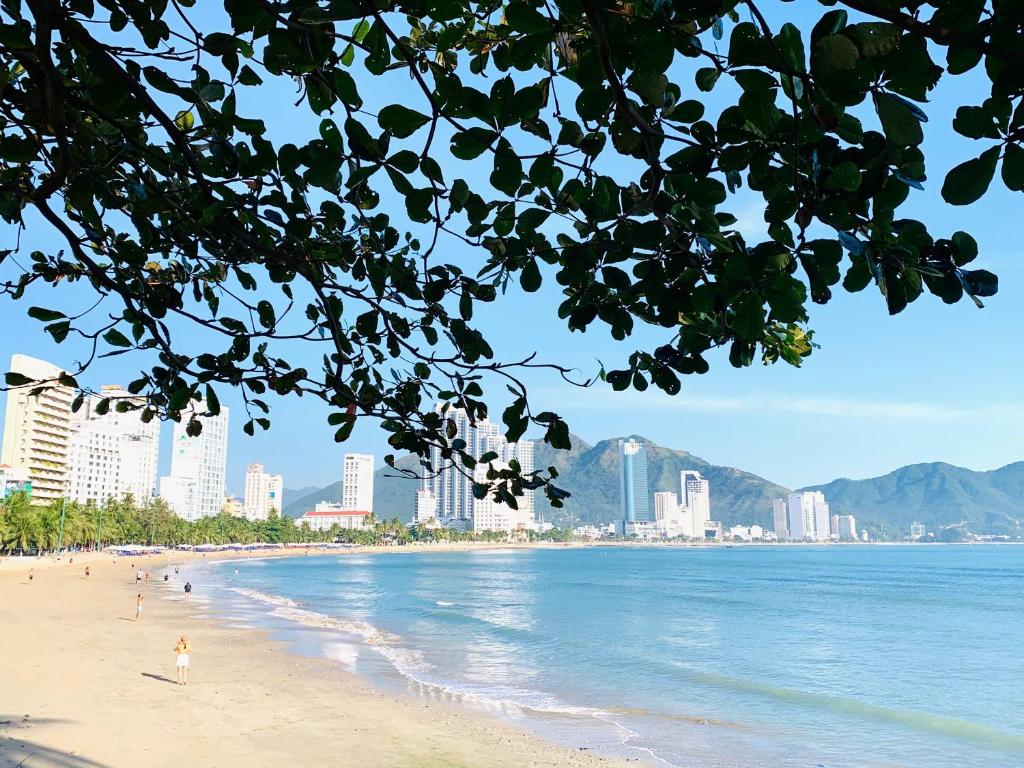 a view of a beach with a city in the background at Media Nha Trang Hotel in Nha Trang