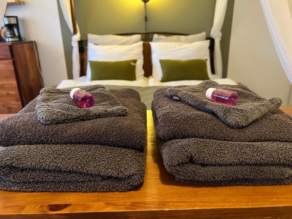 En eller flere senge i et værelse på Heerlijk Gaanderhei