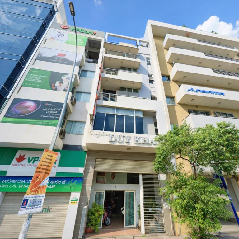 a building with a buy real estate sign on it at Duy Khang 1 Hotel in Ho Chi Minh City