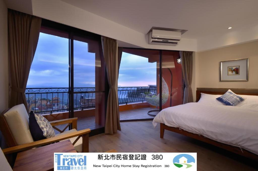 En eller flere senge i et værelse på Sunshine B&B