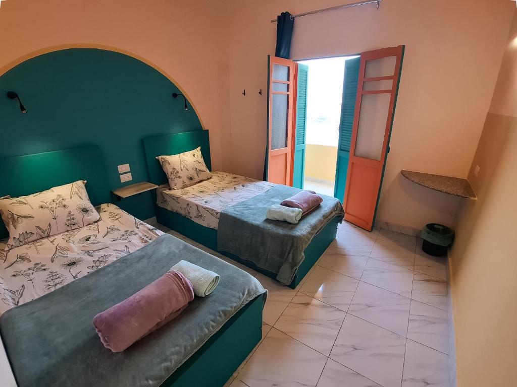 En eller flere senge i et værelse på Bonita Chillhouse