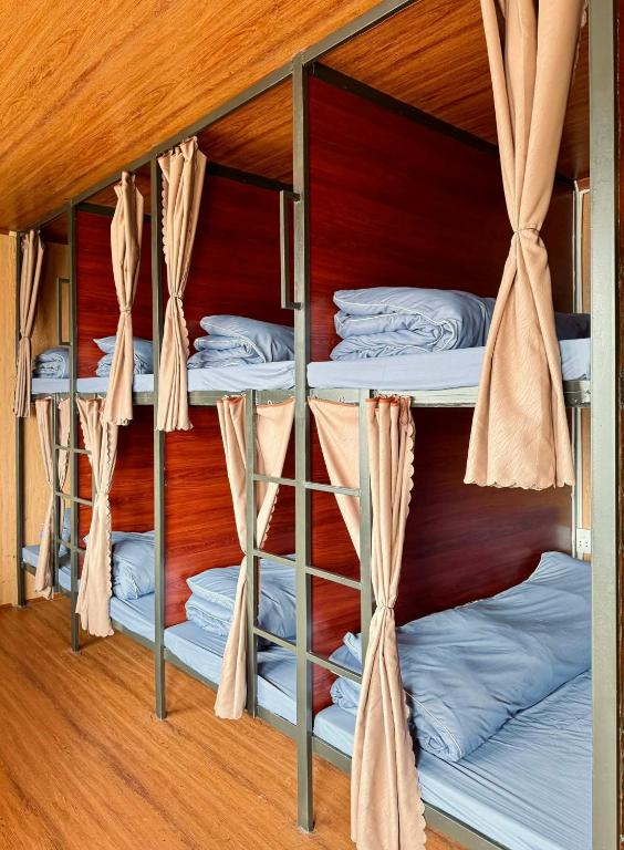 a bunk bed with four bunk beds in a room at Hostel 405 Sa Pa in Sapa