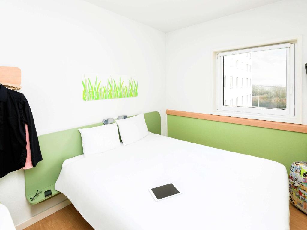 Postel nebo postele na pokoji v ubytování ibis Budget Luxembourg Sud