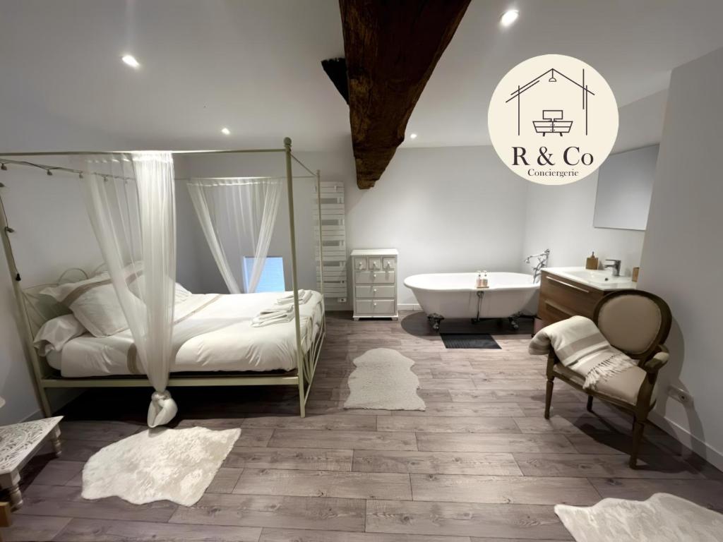 En eller flere senge i et værelse på Gîte romantique dans maison vigneronne