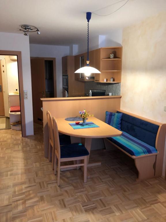 a kitchen and dining room with a table and chairs at Sonnenalpe ckpk in Hermagor