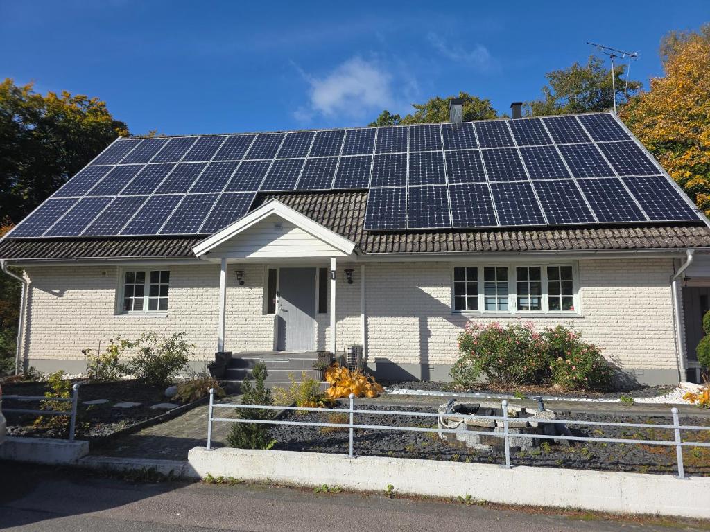 a house with solar panels on the roof at Karlskrona in Rödeby