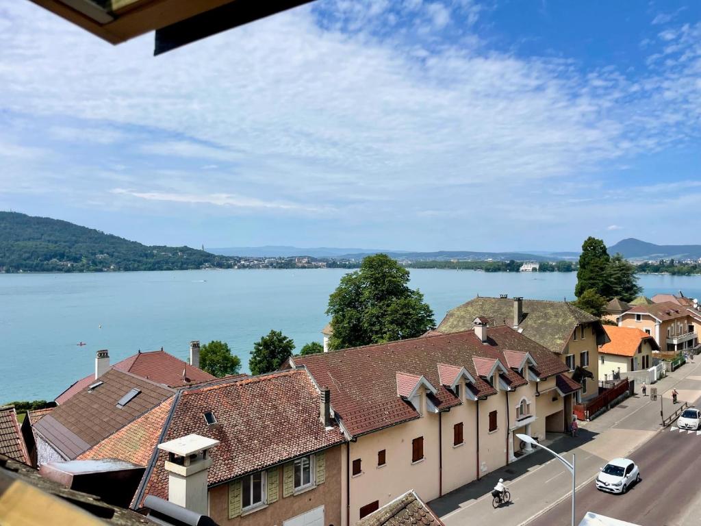 a view of a town next to a lake at Duplex face au lac d'Annecy in Veyrier-du-Lac