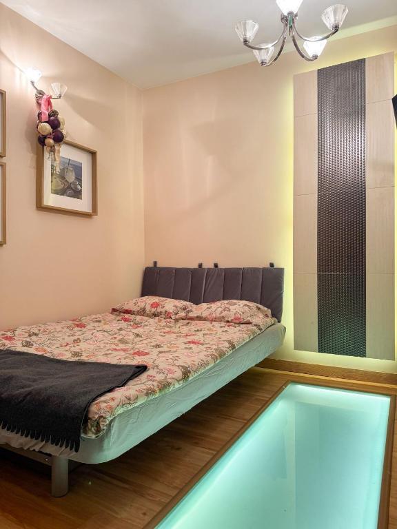 a bedroom with a bed and a swimming pool at Terra Siciliana in Łęczyca