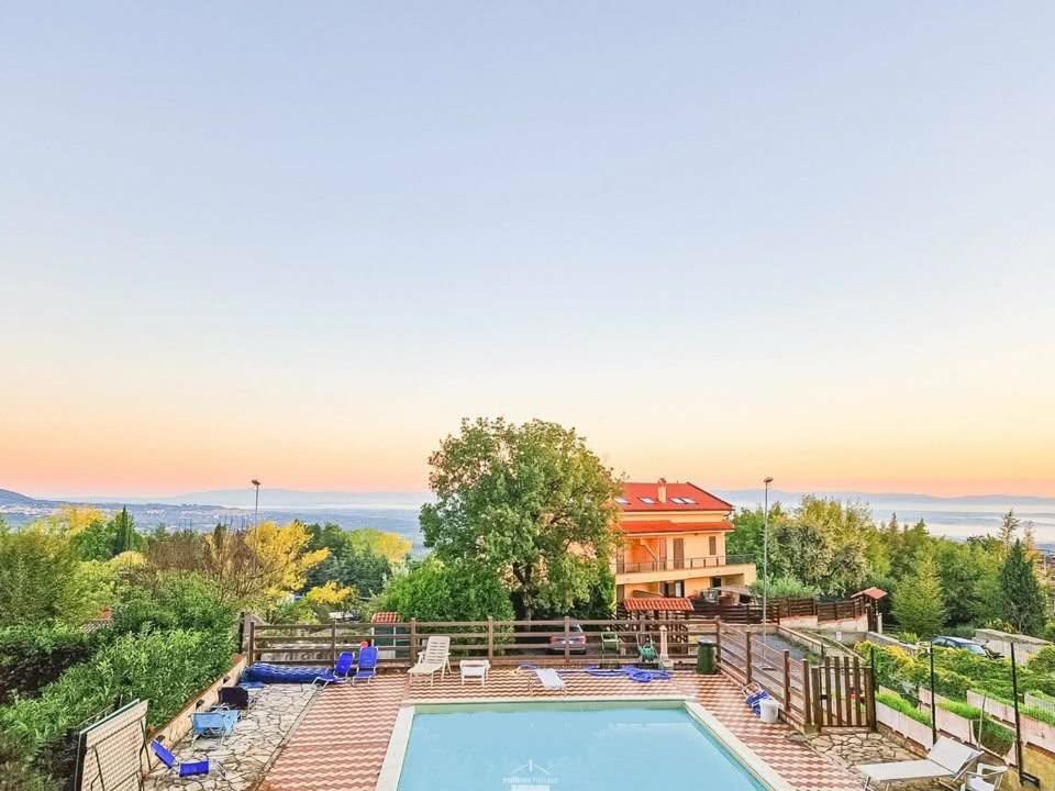 a house with a swimming pool and a house at Bellalisa Tuscany Appartement in Sarteano