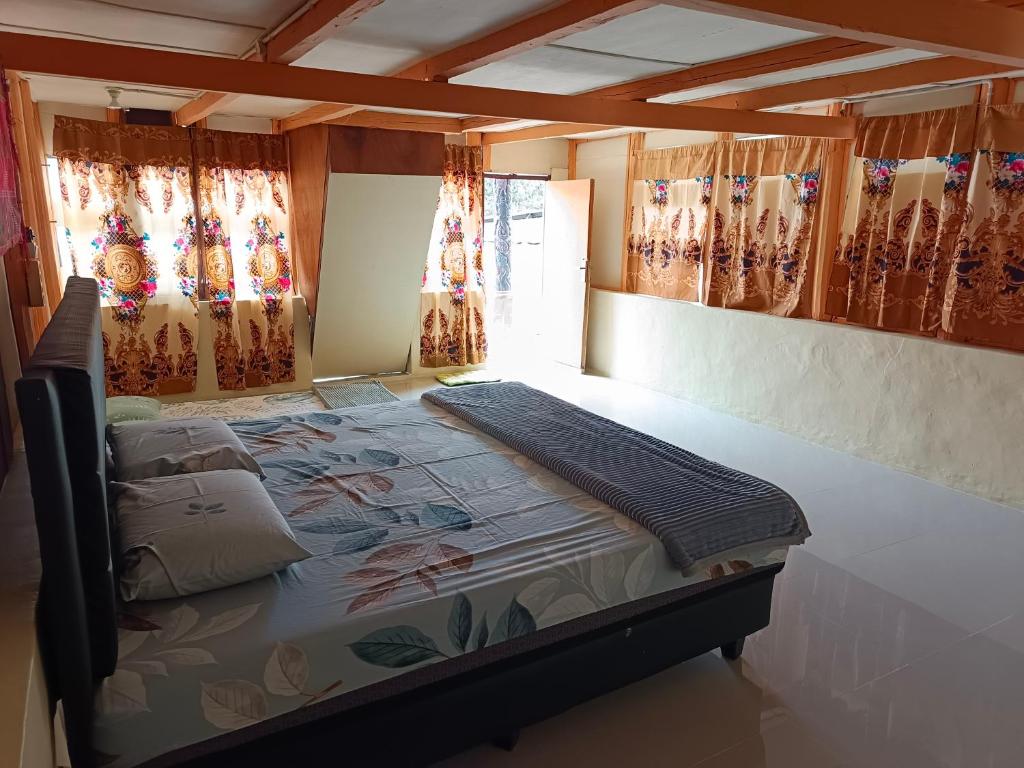 Postel nebo postele na pokoji v ubytování Andaliman House