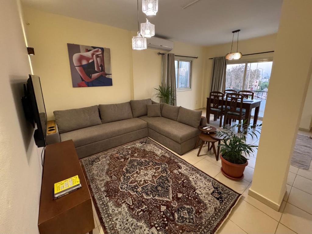 a living room with a couch and a table at Zowaar homes in Dahab