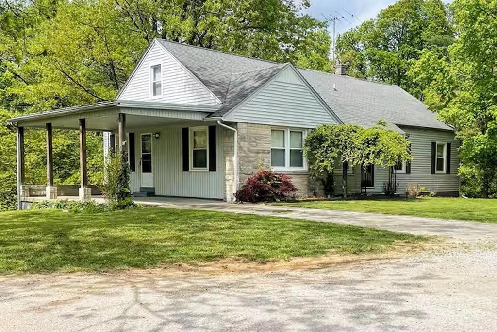 a house with a driveway in front of it at Bourbon Belle of Bardstown in Bardstown