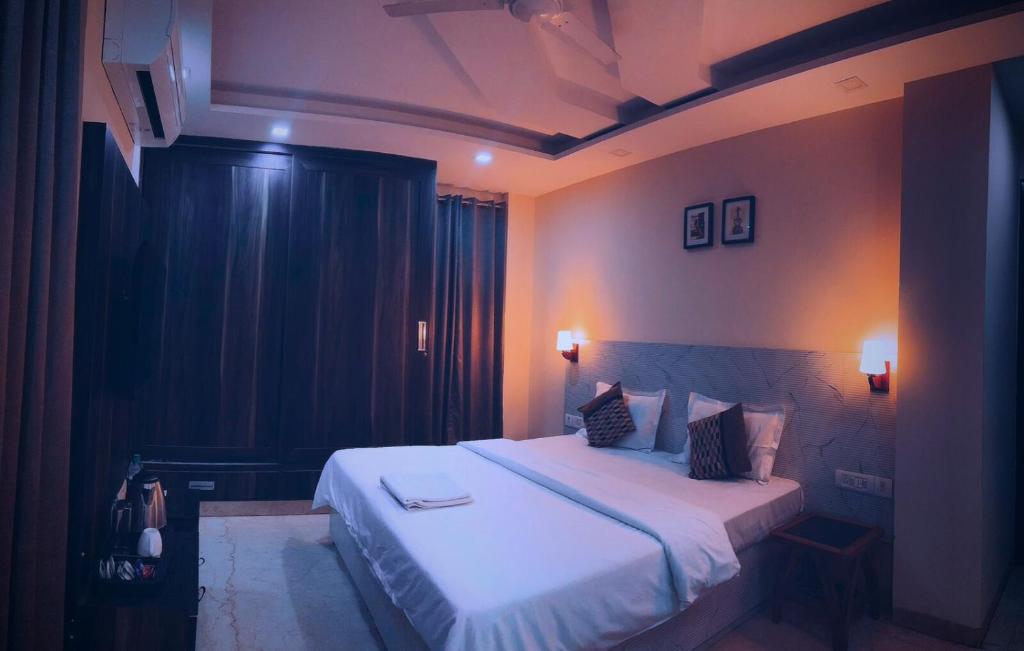 En eller flere senge i et værelse på Cassava Stay