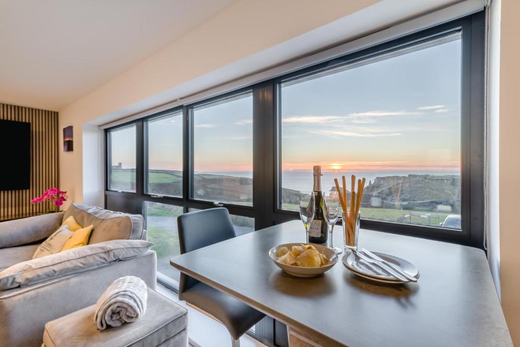 a living room with a table and a large window at 2 Bed in Tintagel oc-g33170 in Tintagel