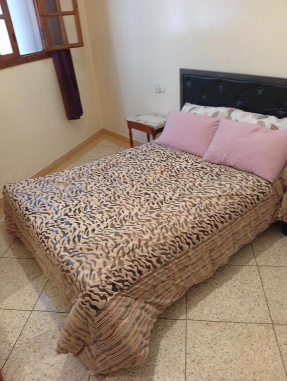 a large bed in a room with at Chez-soi in Meknès