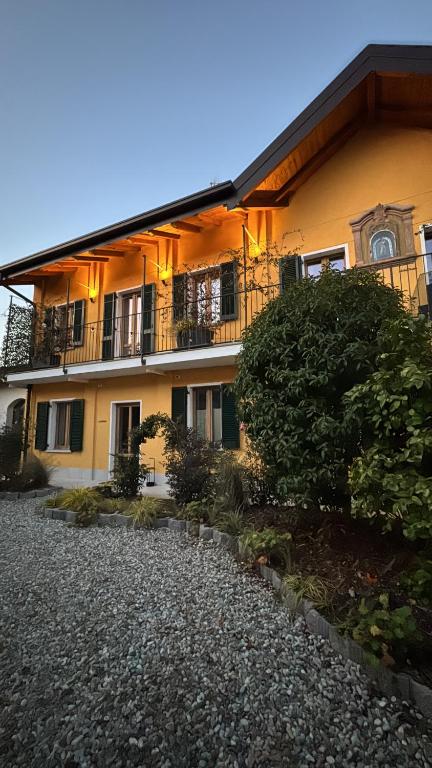 a building with a balcony on the side of it at La SERAFINA in Vanzaghello