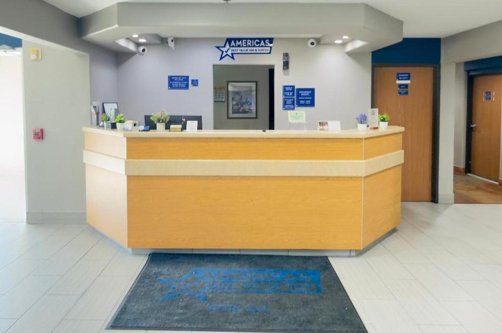 a lobby with a reception desk in a building at Americas Best Value Inn and Suites Ada in Ada