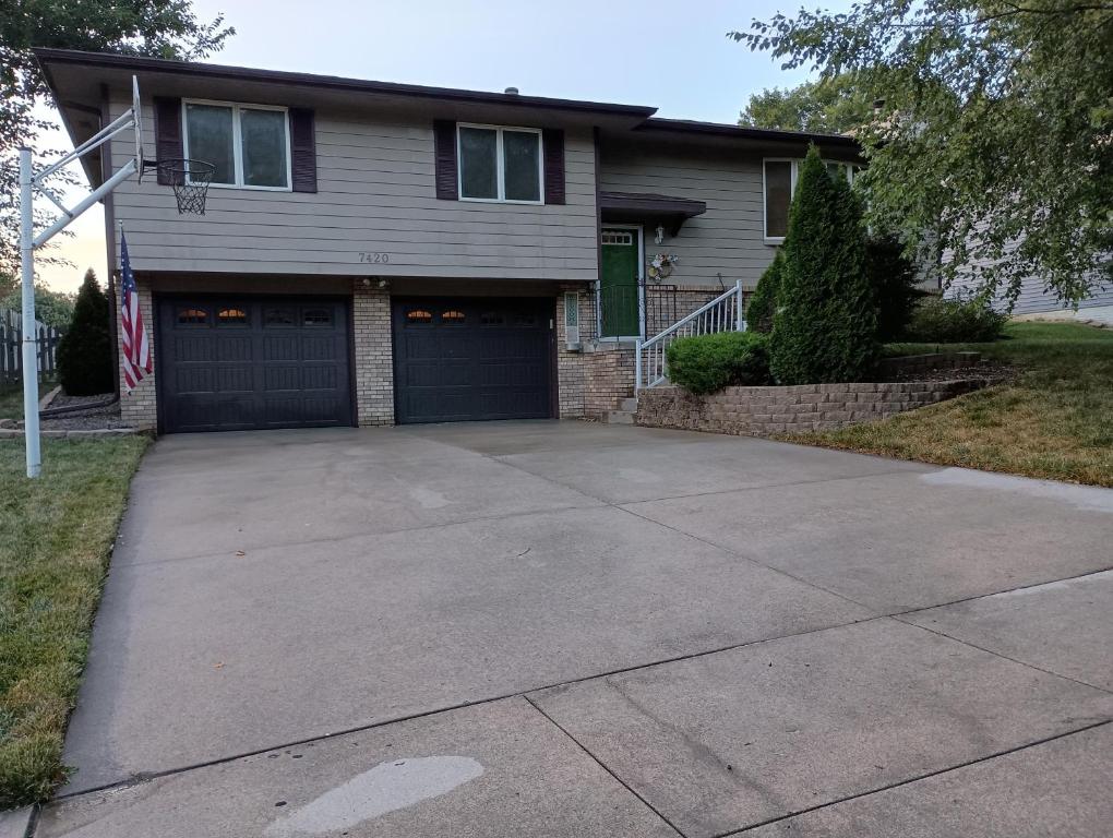 a house with a large driveway in front of it at Poplar Estate in Lincoln