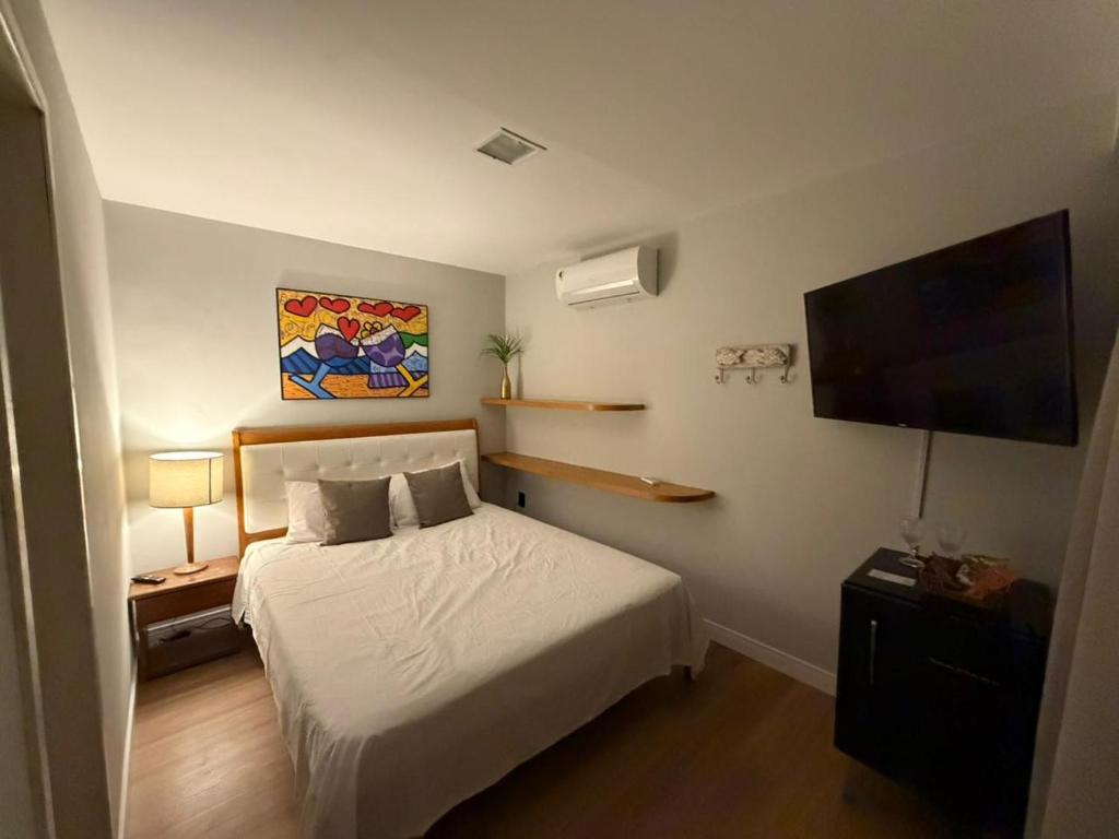 Giường trong phòng chung tại Amélia Pousada de Charme