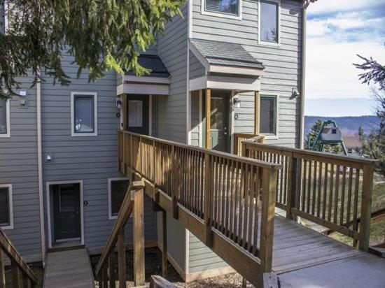 a house with a wooden porch and a deck at Powderidge 2 -Slope Side, Spacious Deck in Snowshoe