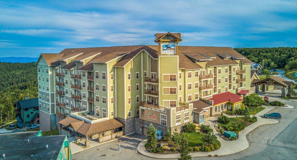 an aerial view of a hotel with a clock tower at Soaring Eagle #403: 2 Bedrooms, 2 Full Baths in Snowshoe