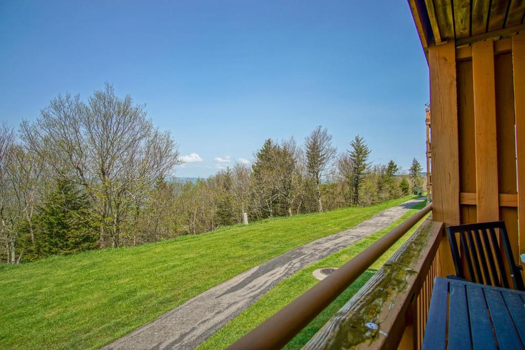 a view of a road from a porch of a house at Summit 107B 3Br Condo in Snowshoe