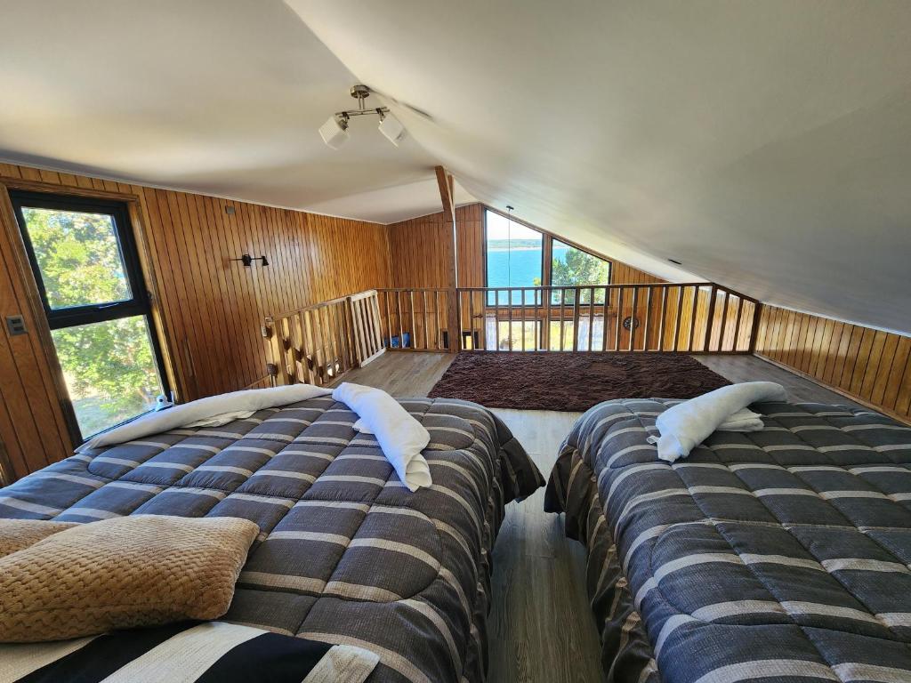 En eller flere senge i et værelse på Cabaña y Tinaja Playa Chaiguao