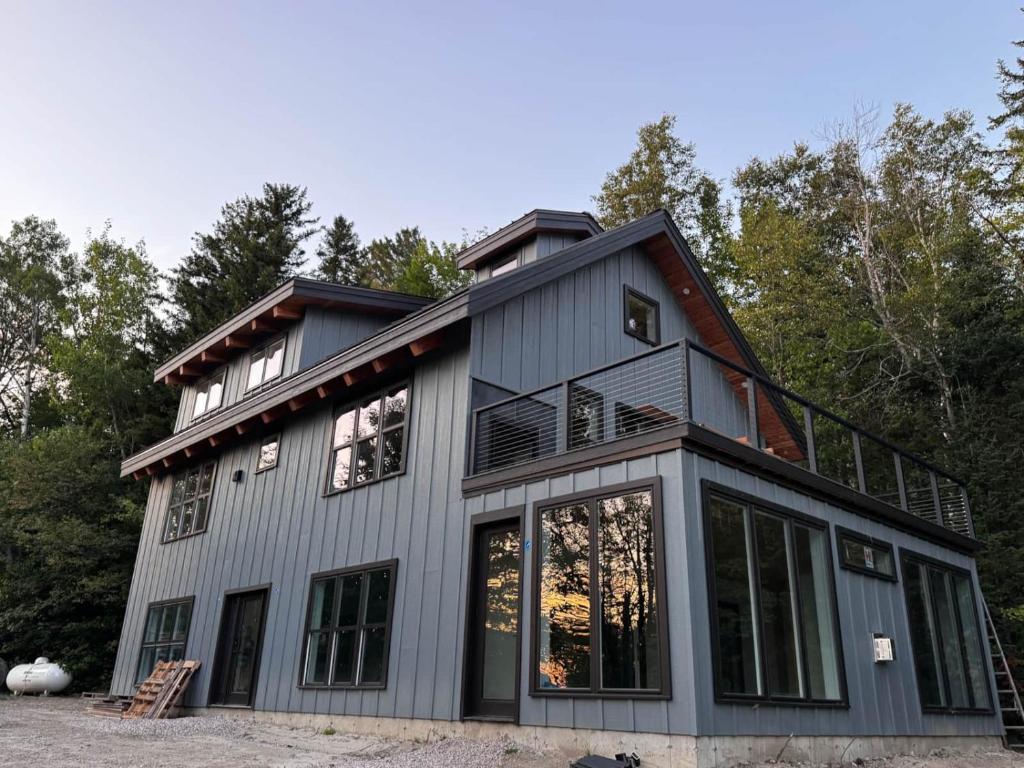 an exterior view of a house with a balcony at The Carriage House at Boulder Mountain View in Carroll