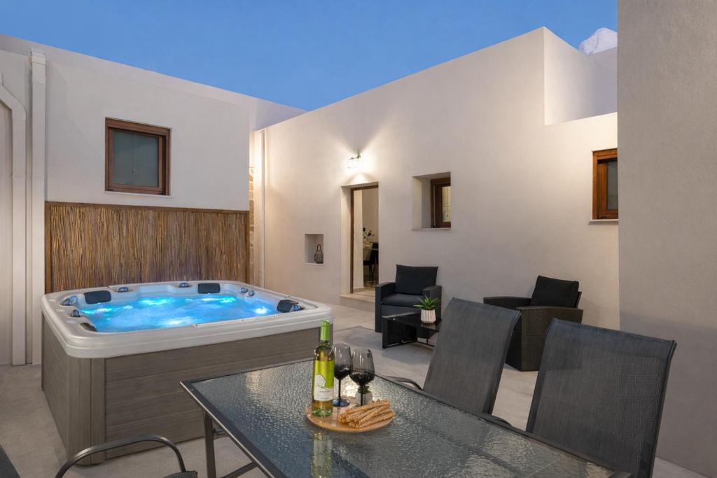 a living room with a jacuzzi tub at Antica Casa Dei Nonni with Heated Jacuzzi in Archangelos