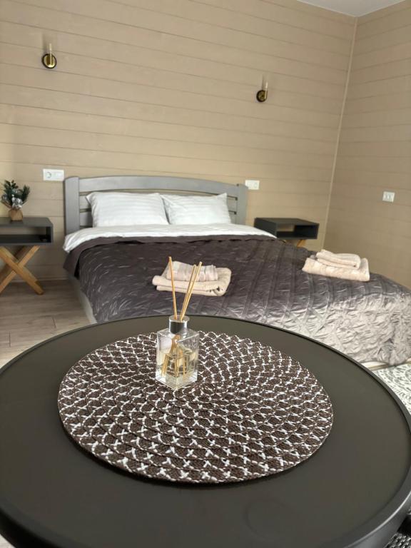 En eller flere senge i et værelse på DIM Котедж в Карпатах