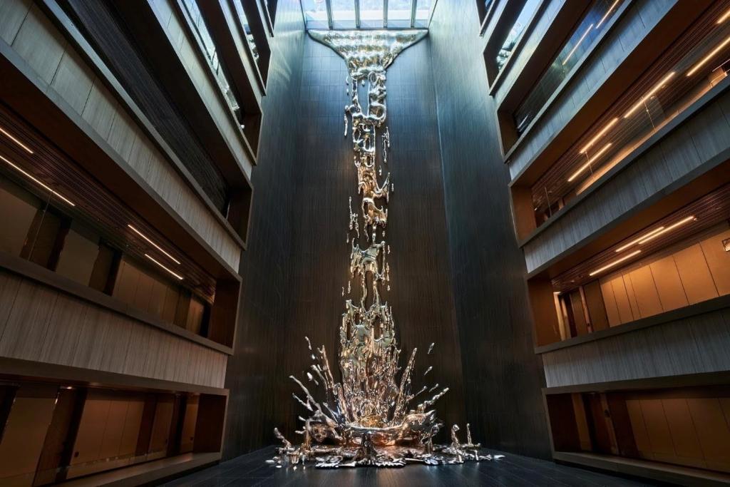 a chandelier in the middle of a building at VP Plaza España Design in Madrid