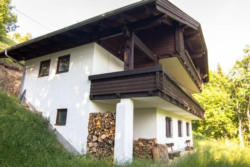a house with a deck on the side of it at Haus Framgard in Zirkitzen