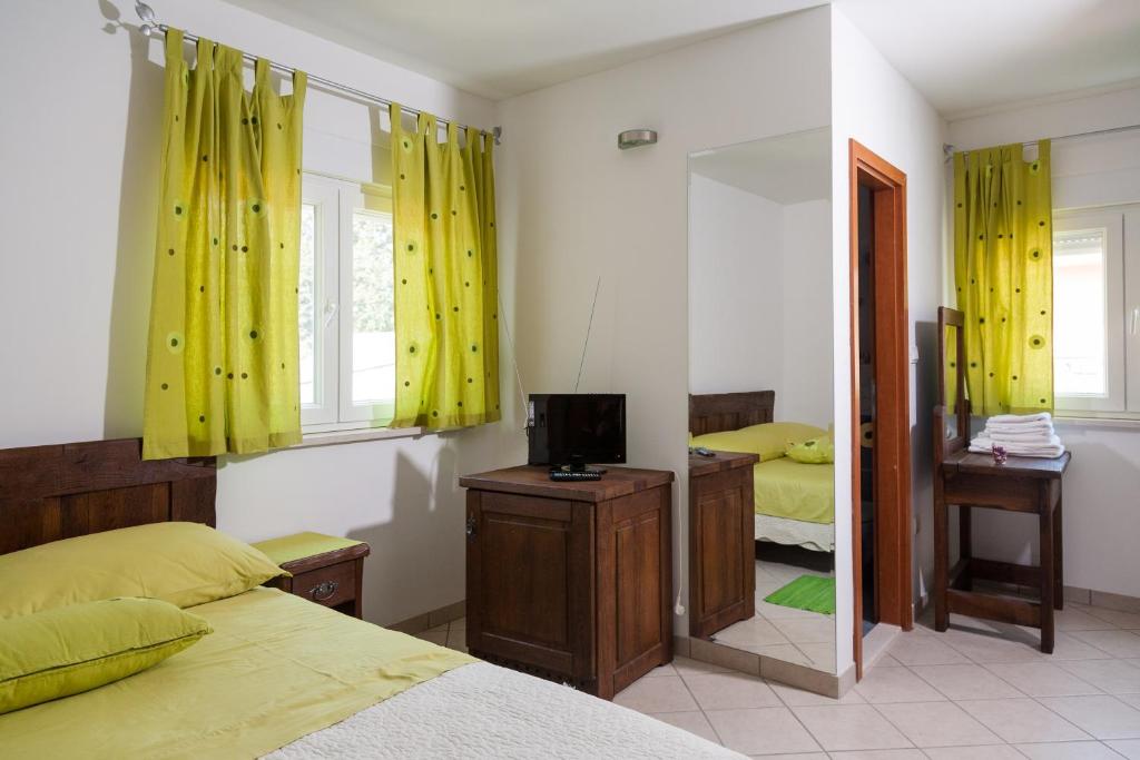 Postel nebo postele na pokoji v ubytování Rooms Vesna