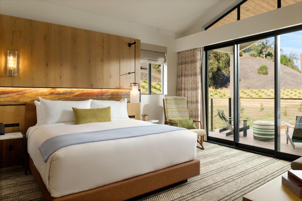 a bedroom with a large bed and a large window at Appellation Healdsburg in Healdsburg