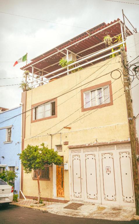 a building with white doors on the side of it at Hostal Guadalajara in Guadalajara