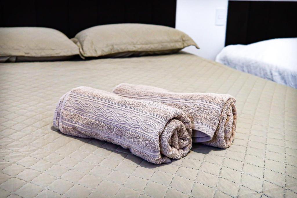 En eller flere senge i et værelse på Hospede-se em Tiradentes - apartamento e suite