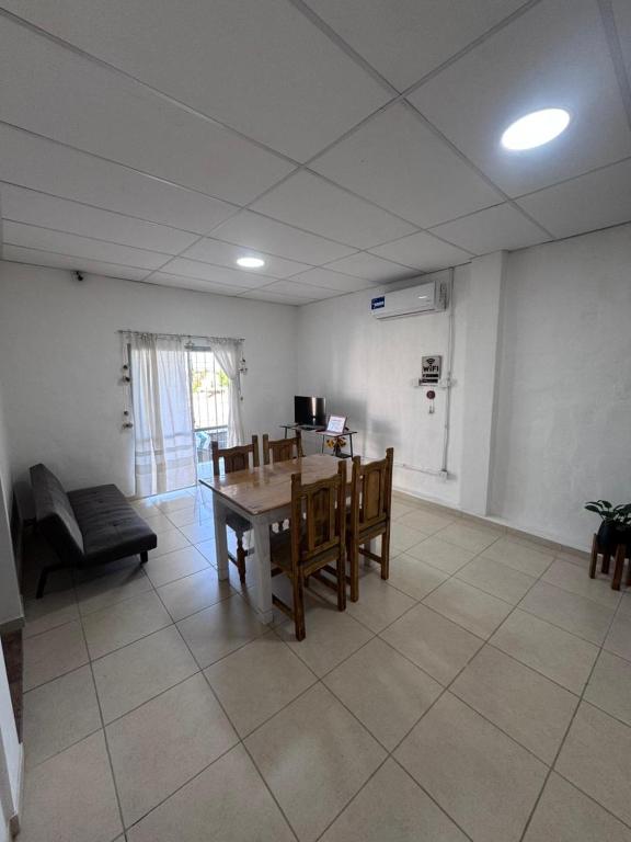 a room with a table and chairs and a couch at Don Francisco in Junín