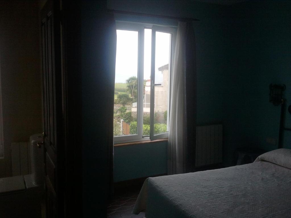 Postel nebo postele na pokoji v ubytování Hotel Los Laureles